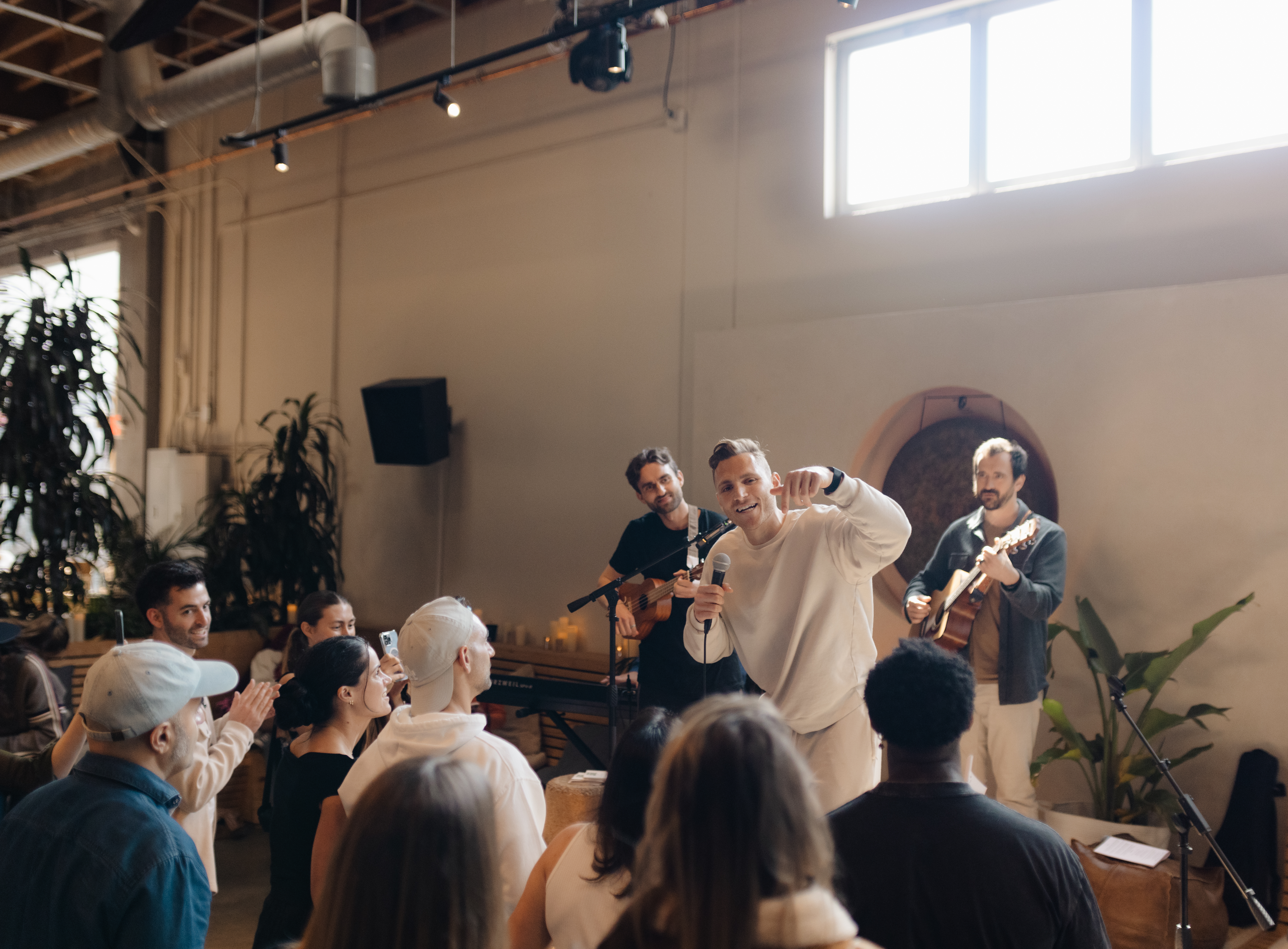 Energy Steve performing live, mic in hand, audience activated